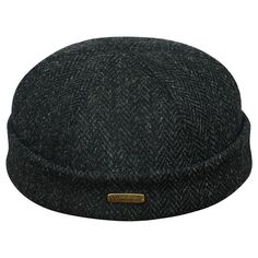 Simple and practical docker cap made of genuine Harris Tweed (100% wool). Harris Tweed cloths are second to none among all wool fabrics. Its cut is above ears, inside the crown there is a cotton lining and sweatband. A cap in a very similar style to the one from the movie ''Léon: the professional''. This model of warm longshoreman hat will protect you from cold and wind, on the rough sea and on the waterfront, during colder seasons. Woolen cloth guarantees excellent wearing comfort - it is warm, Black Herringbone Pattern Flat Cap, Black Wool Beanie Cap, Classic Black Wool Cloche Hat, Classic Black Wool Beanie, Classic Black Hat With Herringbone Pattern, Black Tweed Cap, Black Casual Tweed Hat, Casual Black Tweed Hat, Fiddler Cap