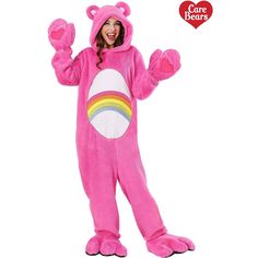 a girl in a pink bear costume is smiling and holding her hands up to the side