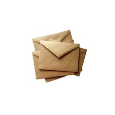 four brown envelopes are stacked on top of each other, with one being folded