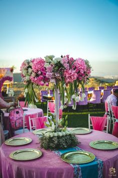 a table with plates and flowers on it