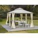 a white gazebo sitting on top of a lush green field