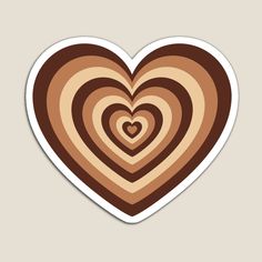 a heart shaped sticker in brown and beige colors on a white background with the words love