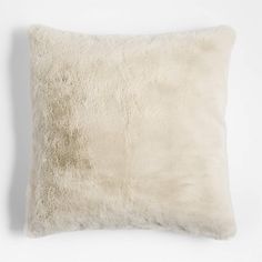 a white pillow that has been made out of sheep's fur and is sitting on a