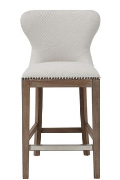 a white upholstered chair with nail polishing on the legs and backrests