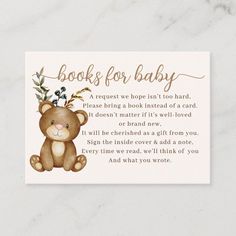 a teddy bear with flowers on its head and the words book for baby written in gold