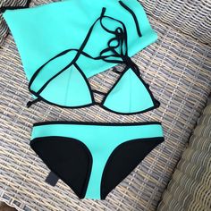 Hello! This Is A Brand New Triangl Bikini In A Size Medium. It Is Turquoise With Black Contrast Trim And Ties. It Has Never Been Worn And Includes The Storage Bag. May Have Slight Wrinkles From Storage But They Smooth Out When Worn, I Have A Few Neoprene Suits And They All Do This. Turquoise Tie-side Bottom Swimwear For Pool, Turquoise Tie-side Swimwear For Pool, Turquoise Triangle Top Beachwear, Turquoise Fitted Tie-side Swimwear, Turquoise Stretch Swimwear Beachwear, Turquoise Stretch Swimwear For Beachwear, Fitted Turquoise Swimwear For Beachwear, Turquoise Beachwear Swimwear, Turquoise Triangle Top Swimwear For Summer