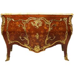 an ornately decorated wooden chest with gold accents