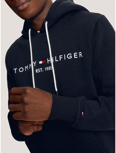 Tommy Hilfiger men's hoodie. Made from soft, brushed-back fleece with a flat, clean face and smooth handfeel, our regular-fit Tommy logo hoodie is just as comfortable as it is cool.  Material: 70% Better Cotton Initiative (bci) Cotton, 30% Polyester - Conventional. Tommy Hilfiger Letter Print Winter Sweatshirt, Tommy Hilfiger Winter Hoodie, Winter Tommy Hilfiger Sweatshirt With Letter Print, Tommy Hilfiger Letter Print Sweatshirt For Winter, Essential Cotton Hoodie For Winter, Winter Essential Cotton Hoodie, Cotton Hooded Sweatshirt, Essential Winter Cotton Hoodie, Essential Cotton Winter Hoodie