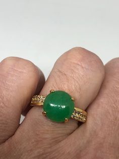 Vintage Lucky Green Nephrite Jade ring Fun jade is color enhanced Large green nephrite jade Ornate German Silver with golden finish Vintage ring, does not tarnish, NOT sterling Size 7 or 8. All rings are shipped free in the US in a nice gift box. Check out our over a THOUSAND great reviews Engraving is $4 per letter and is not always perfect depending on the piece. It can take a few days if the jeweler is busy. This is payable to Paypal Judithsltd@gmail.com Vintage Jade Rings As Gifts, Heirloom Green Jade Jewelry, Classic Green Jade Rings, Abalone Ring, Vintage Hand-strung Jade Jewelry, Vintage Carved Jade Jewelry, Jade Color, Mermaid Ring, Lucky Green