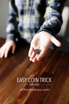 a person holding a coin with the text easy coin trick for kids