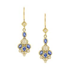 An arrangement of diamonds and blue sapphires hand set in yellow gold. 18k Yellow Gold Blue Sapphire Diamond Satin Finish 18k Yellow Gold Ear Wire .16 ct Diamond 18 mm x 9 mm Please allow up to 7 days in addition to shipping for studio time Style ge265-3 Sand Dollar Earrings, Book Jewelry, Drop Pendant Necklace, Purple Sapphire, Blue Sapphire Diamond, Shop Jewelry, Charm Pendant Necklace, Charm Rings, Champagne Diamond