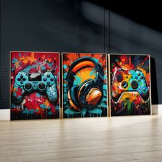 three video game controllers painted on canvass in an empty room