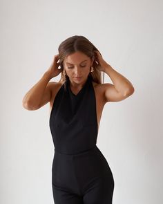 Stretch Halter Neck Bodysuit For Evening, Backless Boning Bodysuit For Night Out, Night Out Boning Backless Bodysuit, Evening Backless Jumpsuits And Rompers, Fitted Jumpsuit With Back Opening For Date Night, Backless Evening Jumpsuits And Rompers, Fitted Tie-back Jumpsuits And Rompers For Night Out, Fitted Jumpsuit With Tie Back For Night Out, Fitted Jumpsuit With Tie Back For Date Night