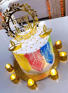 a birthday cake with candles around it on a table