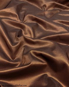 a close up view of a brown satin fabric