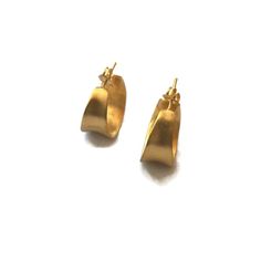 Modern small gold hoops with a modern antiquity feel to them. Cast in silver and plated in 18 K gold.  Light weight post earrings  Details:20 mm diameter .8 inchesWidth at widest point 10 mm  .4 inchesI other hoops in this series https://www.etsy.com/shop/SHERIBERYL?ref=seller-platform-mcnav&search_query=concave+hoopsJoin the club! be in the know for sales, new products , special promotions & flash sales! and receive a GIFT CARD  http://eepurl.com/qhQIv Modern Gold Hammered Hoop Earrings, Contemporary Everyday Gold Jewelry, Elegant Gold Hammered Huggie Earrings, Elegant Hammered Gold Huggie Earrings, Gold Small Hoop Contemporary Earrings, Elegant Handmade Yellow Gold Huggie Earrings, Handmade Yellow Gold Huggie Earrings, Contemporary Gold Hallmarked Jewelry, Contemporary Hallmarked Gold Jewelry