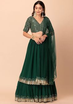 Green Lehenga Choli For Women Indian Wedding Party Wear Lehngas Bridesmaids Ready Made Lahenga Choli With Dupatta Mehendi Wear Chaniya Choli Lehenga (Semi-Stitched) Fabric : Georgette Work : Zari Sequence Embroidery Work  Inner : Micro Cotton with can-can layered net Flair : 3.00 mtr Size : waist-42" Length-42" Blouse (Un stitched) Fabric : Georgette Work : Zari Sequence Embroidery Work  Size : Made up to 42" Dupatta Fabric : Net work : Work Lace Border length : 2.20 mtr What is Semi-Stitched? Semi-stitched Lehenga choli refers to a garment that is partially stitched, leaving the other half open. In this case, the Lehenga is stitched halfway, and the rest remains unfinished. The top part of the lehenga, which includes the blouse or choli, is provided as unstitched fabric, allowing the wear Party Wear Georgette Sets For Celebration, Green Gown With Unstitched Blouse For Party, Wedding Sets With Unstitched Blouse For Eid, Festive Georgette Sets In Floor-length, Green Fitted Party Wear Choli, Green Choli With Cutdana For Party, Semi-stitched Green Choli For Party, Georgette Choli For Wedding Diwali Festival, Georgette Sets For Wedding And Navratri