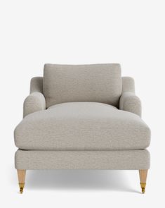 an upholstered chaise lounge chair with wooden legs and armrests in light grey fabric