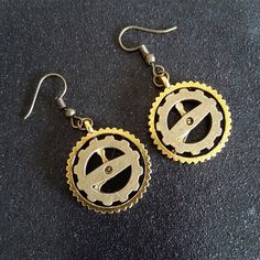 Steampunk Bronze Dangle Earrings With Bronze Hooks. Handmade And New. Gold And Bronze Colored Gears. Gold Single Earring Punk Style, Punk Style Gold Single Earring, Gold Punk Style Single Earring, Gold Punk Style Metal Earrings, Gold Punk Metal Earrings, Gold Punk Single Earring, Nickel Free Brass Steampunk Earrings, Handmade Brown Steampunk Jewelry, Handmade Steampunk Gold Earrings