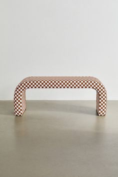 the bench is made out of wood and has a checkered pattern