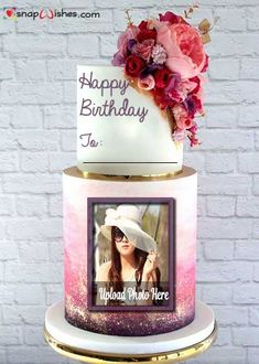 a birthday cake with a photo and flowers on the top is decorated like a woman's hat