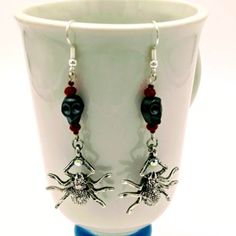 *New*Hand Crafted Spider & Skull Earrings. Gray Resin Skull, Silvertone Sparkly 3 Dimensional Spider, Blood Red Faceted Glass Beads. Nickel Free Ear Wires. Length Is 2.25". Great Gothic Accessory. Handcrafted By Sharon. Spe2 Silver Punk Jewelry For Costume, Silver Punk Costume Jewelry, Punk Style Silver Jewelry For Costumes, Gothic Skull Earrings For Halloween, Fantasy Metal Earrings For Halloween, Fantasy Earrings For Halloween Gift, Fantasy Dangle Earrings For Halloween, Halloween Fantasy Dangle Earrings, Fantasy Halloween Dangle Earrings