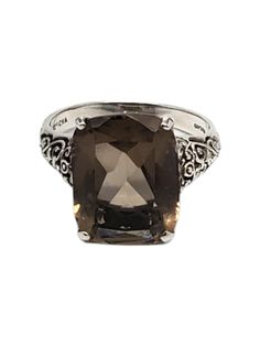 CNA Sterling Silver Smokey Quartz Ring- This lovely vintage ring by CNA is crafted in detailed sterling silver and features a smokey quartz (15.63mm x 12.20mm) gemstone.  Width: 0.6 in. Shank: 0.1 in. Size: 9 Stamped: 925 CNA Thailand Weight: 3.1 dwt./ 4.9 gr. Very good condition, professionally polished. Will come packaged in a gift box or pouch (when possible) and will be shipped U.S. Priority Mail Insured. LP04152417KCS Classic Smoky Quartz Rings For Formal Occasions, Classic Smoky Quartz Jewelry For Formal Occasions, Classic Formal Smoky Quartz Rings, Formal Silver Smoky Quartz Jewelry, Smokey Quartz Ring, Quartz Ring, Smokey Quartz, Vintage Ring, Solitaire Ring