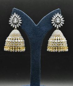 A American diamond earing with pressing style back Bollywood Diamond Gold Jhumkas, Bollywood Gold Diamond Jhumkas, Bollywood Style Diamond Gold Jhumkas, Bollywood Style Gold Diamond Jhumkas, Gold Diamond Bridal Earrings With Latkans, Gold Bridal Earrings With Diamond Latkans, Gold Diamond Bollywood Earrings, Bollywood Gold Diamond Earrings, Bollywood Style Gold Diamond Earrings