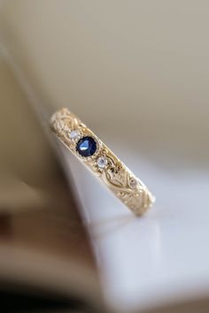 Blue sapphire wedding band, ivy leaf ring with diamonds, comfort fit ring | Eden Garden Jewelry™ Gold Ring With Sapphire, Wedding Ring With Sapphire Accents, Elven Engagement Rings, Simple Sapphire Ring, Unique Engagement Rings For Men, Alexandrite Wedding Band, Victorian Wedding Ring, Unique Wedding Bands For Women, Elven Wedding