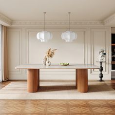 an elegant dining room with white walls and wood flooring