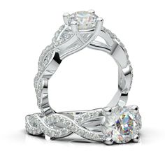 a white gold engagement ring set with an oval cut diamond surrounded by round brilliant diamonds