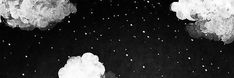 black and white photograph of clouds in the night sky with snow falling on them,