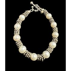 This vintage bracelet is a stunning piece of fine jewelry that will surely catch anyone's eye. Made of sterling silver and adorned with beautiful freshwater pearls, this bracelet exudes elegance and sophistication. The toggle closure adds a touch of convenience and practicality to the design.  The bracelet measures 7.25 inches in length and features a beaded style with cream-colored pearls. The piece is perfect for any occasion and will make a great addition to any jewelry collection. This vintage bracelet is a must-have for women who appreciate timeless beauty and classic style. Pearls are 6mm and the bracelet weighs 26.3 grams Vintage Silver Pearl Bracelets, Vintage Adjustable Pearl Bracelet With Metal, Nickel-free Sterling Silver Pearl Bracelet Gift, Elegant Multi-strand Adjustable Pearl Bracelet, Adjustable Nickel-free Sterling Silver Pearl Bracelet, Colored Pearls, Freshwater Pearl Bracelet, Toggle Bracelet, Vintage Bracelet