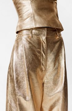 Sparkle meets swagger in wide-legged leather pants presented in a gleaming golden finish. Zip fly with hook-and-bar closure Side-seam pockets Lined Leather Professional leather clean Imported Gold Pants, Waistcoat Dress, Leather Trousers, Tshirt Skirt, Hair Accessories Jewelry, Denim Coat, Fashion Story, Dress Trousers, Shirt Skirt