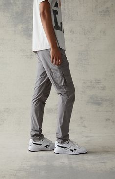 Casual meets cool with the new Eco Stretch Gray Slim Cargo Pants from PacSun. This go-to pair is designed with an elastic stretch waistline, adjustable drawstrings, side pockets, zip cargo pockets, a drawcord hem, and a slim fit.

Learn more about PacSun eco items Athleisure Cotton Cargo Pants With Multiple Pockets, Casual Fitted Cargo Pants With Elastic Waistband, Functional Relaxed Fit Cargo Pants With Pockets, Sporty Fitted Cargo Pants With Pockets, Fitted Sporty Cargo Pants With Pockets, Relaxed Fit Cargo Pants With Cargo Pockets For Athleisure, Relaxed Fit Cargo Pants With Functional Style, Gray Cargo Bottoms For Outdoor Activities, Athleisure Cotton Cargo Pants With Pockets