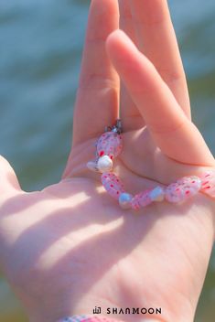 Flowing with effortless grace in a mesmerizing blend of blue and marine hues, this bracelet is a celebration of the ocean's hidden treasures, crafted with skillful artistry and woven with secrets waiting to be discovered. Material: Flower Glass Beads, Freshwater Pearls Craft: Handmade Size: 18-24cm Color: Pink Care: Keep away from chemicals; Avoid scratches; Clean with a soft fabric *This item is non-refundable. Ocean-inspired Beaded Bracelet Jewelry, Handmade Pink Ocean-inspired Jewelry, Handmade Ocean-inspired Pink Jewelry, Handmade Beach Bangle Jewelry, Beaded Strand Jewelry Gift, Ocean-inspired Colorful Beads Jewelry, Ocean-inspired Adjustable Jewelry With Colorful Beads, Handmade Ocean-inspired Jewelry With Round Beads, Adjustable Beaded Ocean-inspired Jewelry