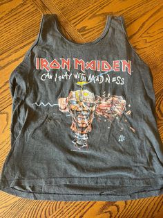 Iron Maiden 1988 sleeveless shirt. This shirt is VINATGE. This shirt was worn by a human for years, over 30 years ago, and therefore wear-and-tear is part of it. There may be imperfections, fade, etc. that I didn't account for. Casual Cotton Vest For Concert, Vintage Tank T-shirt For Summer, Acid Wash Distressed Sleeveless Top, Distressed Sleeveless Top For Streetwear, Vintage Summer Tops For Concert, Vintage Tops For Summer Concerts, Grunge Cotton Vest With Graphic Print, Cotton Grunge Vest With Graphic Print, Cotton Grunge Vest For Concerts