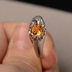 This is a gorgeous handmade creation. Its beauty is its simplicity & Elegance. The 6*6mm round shape faceted natural citrine is crafted in solid sterling silver and with rhodium plated. All item is sent in a beautiful gift box If you have any idea of design your ring,pls contact me directly. You can realize more lovely stuff clicking the link https://www.etsy.com/shop/knightjewelry?refshopsection_shophome_leftnav Please leave the correct address and you phone number for delivering successful Citrine Topaz Promise Ring, Fine Jewelry Citrine Crystal Ring With Birthstone, Citrine Birthstone Crystal Ring Fine Jewelry, Elegant Citrine Gemstone Signet Ring, Formal Citrine Solitaire Birthstone Ring, Elegant Citrine Signet Ring With Gemstone, White Gold Citrine Birthstone Ring With Gemstone, Orange Topaz Round Ring, Formal Birthstone Topaz Ring