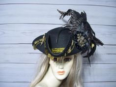 Ladies one of a kind black nice quality faux straw pirate hat with gold coins around the brim with black braid, a large gold metal 3" octopus accent on one side and a metal mermaid charm on the other and these Beautiful long flowing all natural coque feathers. These are all natural, so they are not perfect, please keep this in mind. Please measure your head, this hat is 22.5" for the inside circumference with a built-in hat sizer. Just cinch and tie. I cannot make the circumference bigger. If you have any questions, please let me know before purchasing as I cannot change anything on the hat. It is a one-of-a-kind hat so once it's gone, it's gone. Check out my other items. Please let me know if you have any questions All sales are FINAL, no returns or exchanges please keep this in mind befo Tricorn Hat, Black Pirate, Pirate Costumes, Pirate Hat, Steampunk Hat, Pirate Hats, Pirate Costume, Costume Hats, Black Braids