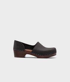 low heeled closed-back clogs in black nubuck leather stapled on a dark wooden base Cork Sandals, Wooden Clogs, Clog Sandals, Elegant Shoes, Boot Shop, Dark Black, Low Heels, Clogs, Heel Height