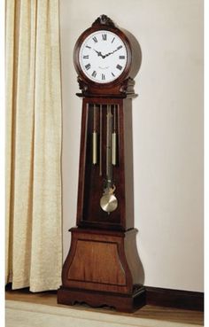 an old fashioned grandfather clock with pendulums