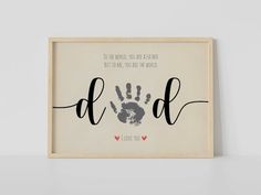 a framed print with the words dad and hand prints