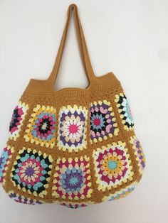 Mustard Color Crochet Granny Square Long Handle Shoulder Bag, Crochet Bag, Summer Bag, Crochet Totes, Granny Bag, Crochet Tote Bag Handmade This beautiful handmade bag 🌸 is perfect for completing your outfits. 55% Cotton - 45% Pac Light and handy Width: 45 cm - 17,3 inch Length: 33 cm - 12,9 inch Overall height with bag handle approximately : 55 cm - 21,6 inch There is one inner pocket. Dry cleaning recommended 🌸 Thank you so much 🌸 Beige Granny Square Bag For Beach, Brown Crochet Tote Bag With Granny Square, Beige Granny Square Bag For The Beach, Beige Granny Square Shoulder Bag, Brown Granny Square Crochet Tote Bag, Everyday Brown Crochet Bag With Granny Square, Beige Granny Square Crochet Tote Bag, Brown Crochet Bag With Granny Square For Vacation, Brown Crochet Bag With Granny Square Design