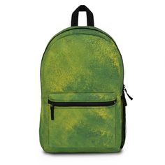 a green backpack with black handles and zippers on the front, sitting against a white background