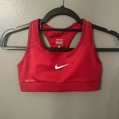 Red Nike Sports Bra Never Worn Red Casual Activewear For Sports, Red Nike Activewear For Gym, Red Racerback Sports Bra For Gym, University Red Moisture-wicking Activewear, Sporty Red Racerback Sports Bra, Red Racerback Activewear For Training, Red Sporty Racerback Top, Red Racerback Sports Bra For Workout, Sporty Red Racerback Top