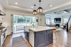 a large kitchen with an island in the middle