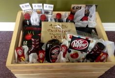 a wooden box with condiments and snacks in it sitting on carpeted floor