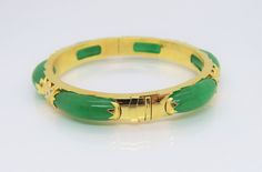 Vintage 18K Solid Yellow Gold Translucent Green Jadeite Jade & White Topaz Bamboo Bangle Bracelet ....Marked 18K...Total of weights 30.8grams...Measure inside 53MM W 8.1MM...With 06 Green Jades 21.5 x 7.5MM ...It's in very good condition. #475680 Luxury Green Gemstone Bangle, Green Bangle For Formal Occasions, Fine Jewelry Style, Green Bangle Bracelet For Formal Occasions, Green Bangle Bracelets For Formal Occasions, Formal Green Bangle Bracelets, Elegant Jade Bangle, Formal Yellow Gold Jade Bracelets, Formal Yellow Gold Jade Bracelet, Elegant Green Round Bangle