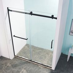 a bathroom with a walk in shower next to a white chair and blue painted walls