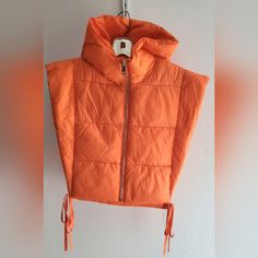 Women Puffer Hoodie Vest Color Orange Polyester With Laces On The Side Front Zipper Size Small See Pictures For Measurements P14 Orange Flower Puffer Vest, Functional Orange Hooded Outerwear, Orange Crop Puffer Vest, Orange Winter Sports Hoodie, Red Nylon Puffer Outerwear, Hoodie Vest, Front Zipper, Orange Color, Coats For Women